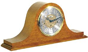 Hermle 21134-i90340 Oak Keywound Chiming Mantel Clock Keywound Chiming mantel clock. Traditionally styled tambour case with an oak finish. The dial features a diamond turned chapter ring with embossed Arabic numerals and a beautiful embossed center....