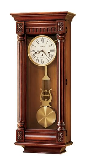 Howard Miller 620-196 New Haven Westminster Keywound Wall Clock This keywound wall clock is lightly distressed in a soft sheen Cherry.   Accenting the pediment and base are four carved overlays and a dentil molding above the dial. Fluted columns frame the...