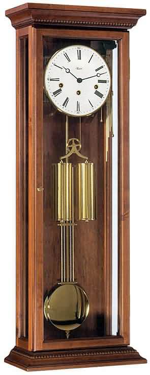 Hermle 70700-Q10351 Antique Walnut Westminster Chime Regulator Wall Clock Solid Antique Walnut weight-driven Vienna Regulator clock. Antique case in a satin <b>Walnut finish is made of aged wood from old Black Forest farm houses.</b> This model features  glass side...