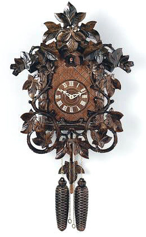 809-18 Leaves and Vines 8 Day Black Forest Cuckoo Clock Genuine Black Forest Cuckoo clock with hand-carved Leaves and Vines surrounding the house. Door opens where the Cuckoo bird will appear and 