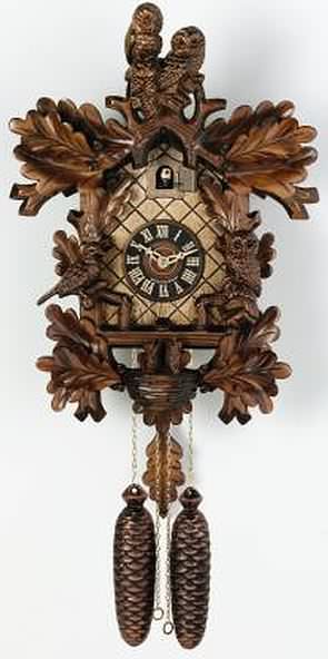 831-18 Black Forest 8 Day Nesting Birds and Owls Cuckoo Clock Genuine Black Forest Cuckoo clock with nesting birds and 3 Owls. Door opens where the Cuckoo bird will appear and 