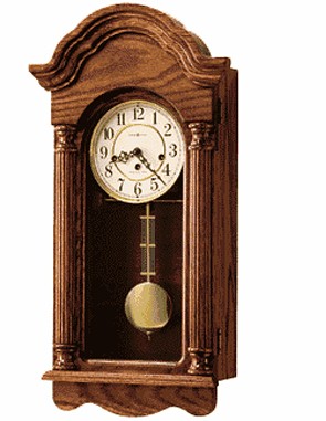 Howard Miller 620-232 Daniel Keywound Wall Clock This Oak keywind wall clock features a gently arched bonnet. Ivory dial features polished brass bezel, Arabic numerals and decorative hands. Polished brass pendulum features a decorative grid....
