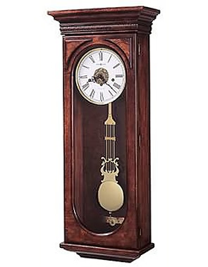 Howard Miller Ernest 620-433 Keywound Wall Clock This wall clock offers exquisite details from top to bottom. Distressed Hampton Cherry finish.   Carved acanthus leaf molding wraps around the pediment and decorative burl back panel.  German...